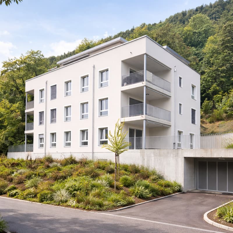 White house, 3 floors, multiple balconies, underground garage, green landscape