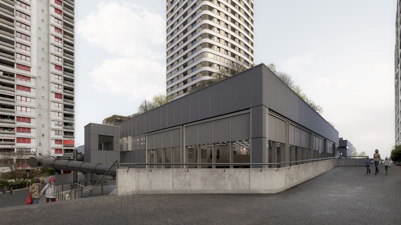 Building in modern design with large windows, grey roof with garden, slide and railing, concrete pavement, two highrise buildings at the background