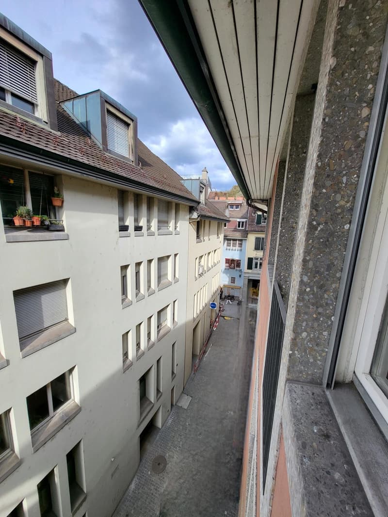 Multistory residential building with several windows and balconies