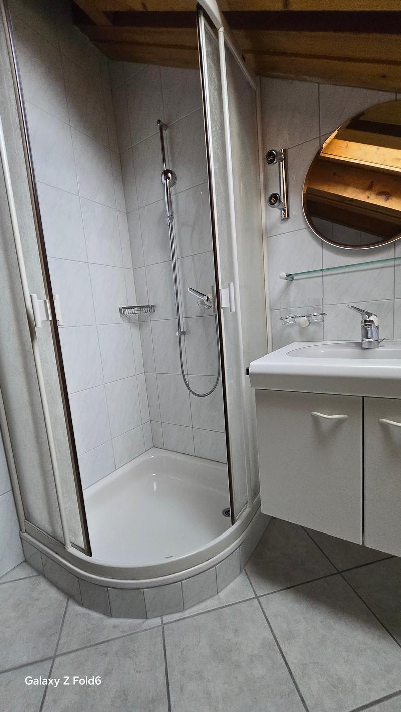 shower, sink, mirror, white tiles, shower head, faucet, cabinet