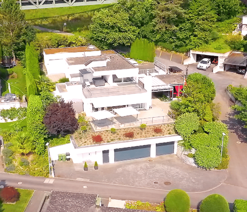 Two story house, large terrace, carport, garden, garage, green roof, trees and plants
