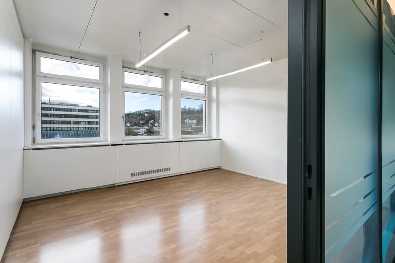 wooden floor, large windows, bright room