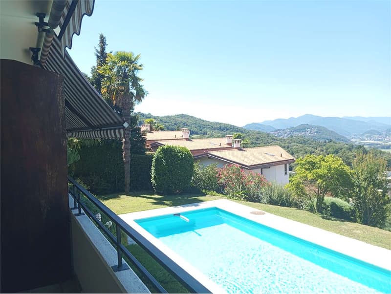 Comano - Elegante appartamento 2.5 locali con piscina e vista panorami (7)