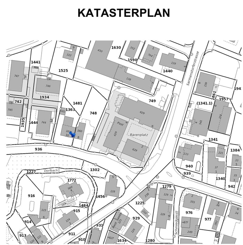 The image shows a detailed cadastral map or site plan, with various buildings, plots, and infrastructure elements labeled. The map includes street names, building numbers, and other identifiers. There are no visible features from the list provided.