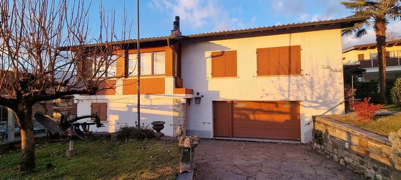 Two story house, brick bottom, wood top, double garage
