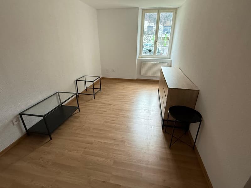empty room, wooden floor, white walls, glass tables, window, radiator