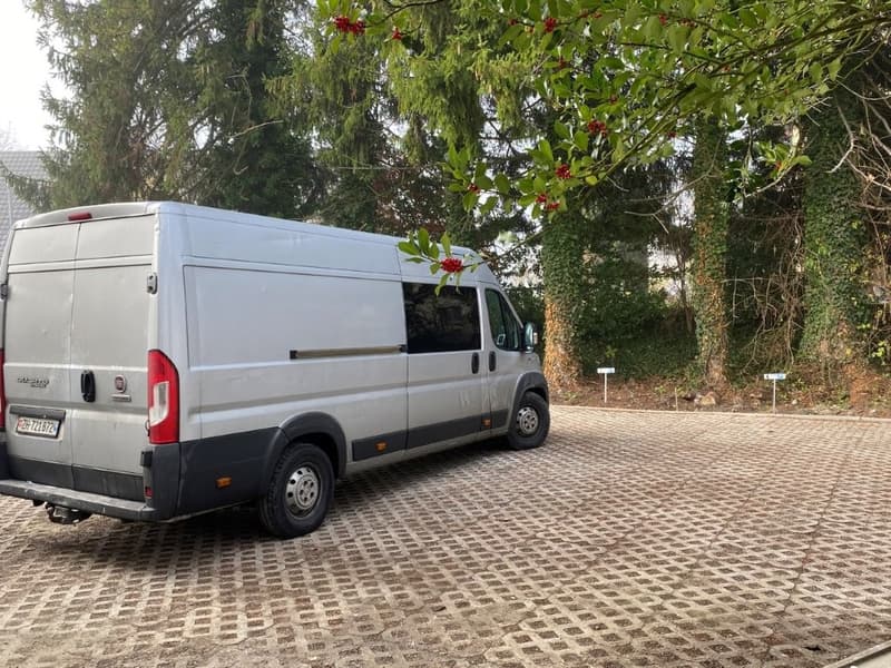 white van parked on a paved parking lot