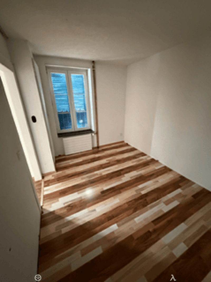 empty room, hardwood floors, white walls, window with white frames, wooden window sill