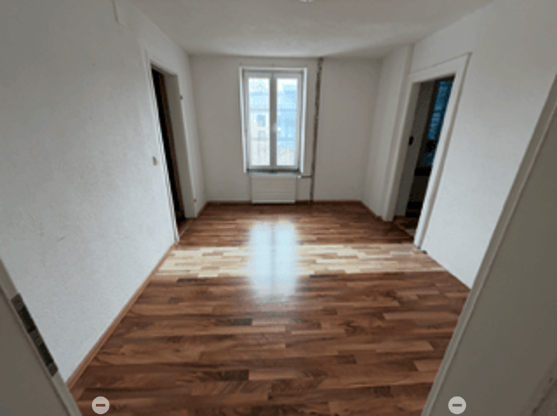 empty room, wooden floor, two doors, one window