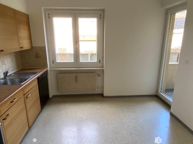wooden cabinets, granite counter, stainless steel sink, dishwasher, window, heating