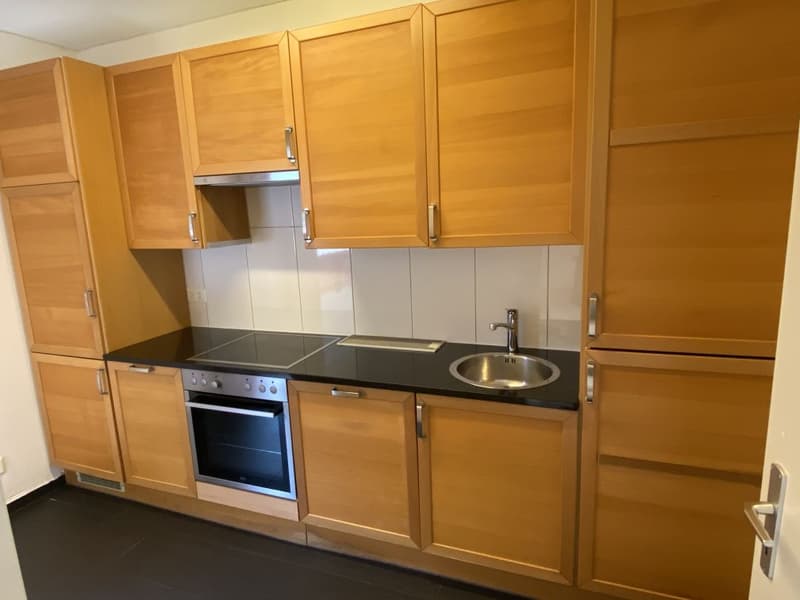 kitchen with oven, hob, sink, tiles, cabinets, counter top