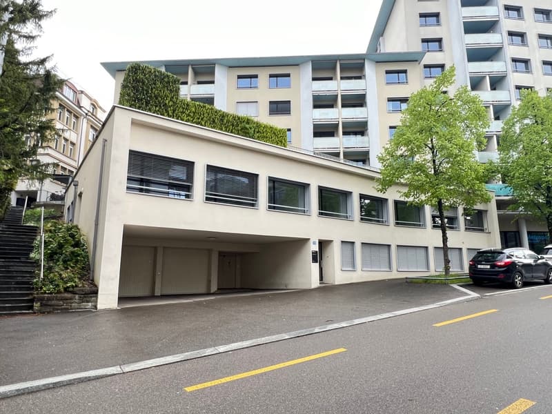 Multi-storey building, underground garage, green rooftop, modern architecture