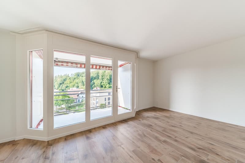 empty, wooden floor, large glass doors leading to balcony, panoramic views