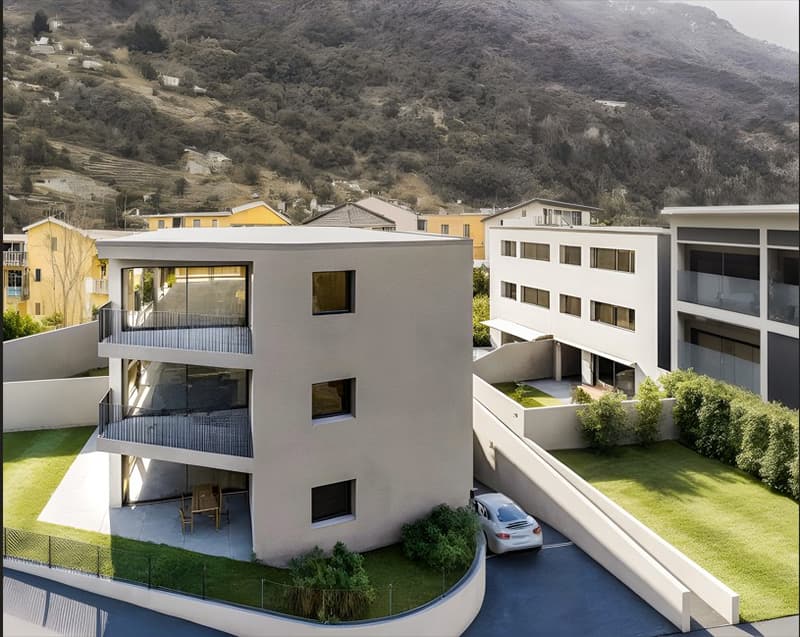 3-story apartment building with balconies, parking spaces, and landscaped grounds surrounded by hills and mountains