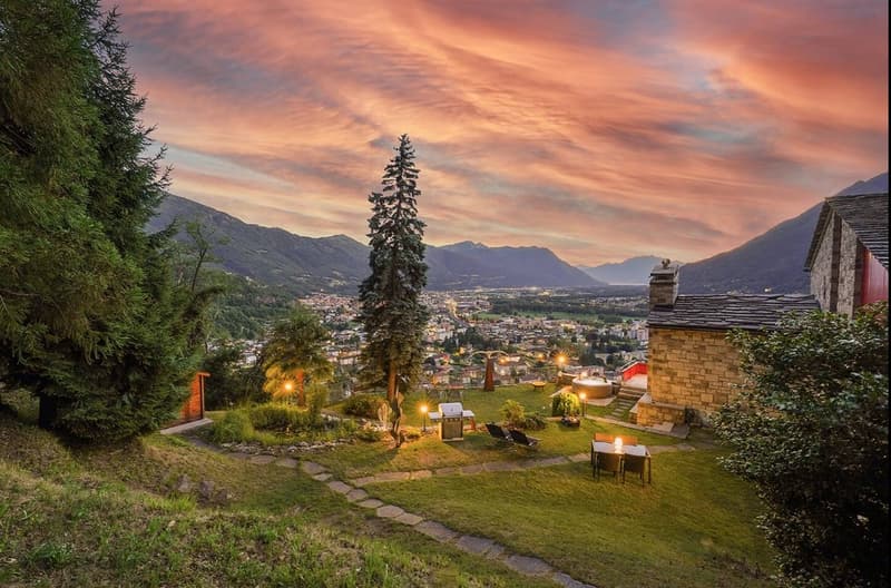 Garden with mountains, city view, fireplace, grilling area, lounge chairs, dining table, small fountain