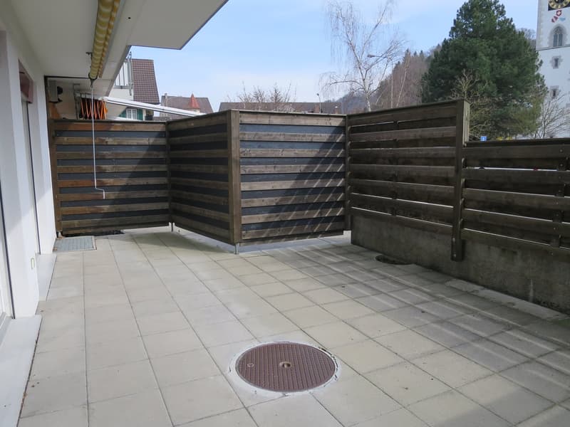 tiled floor, wooden fence, manhole cover, outdoor area