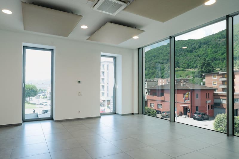 Large windows, tiled floor, large glass doors