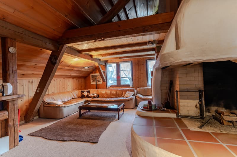Wohnzimmer mit Cheminée im OG