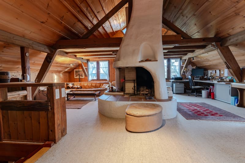 Wohnzimmer mit Cheminée im OG