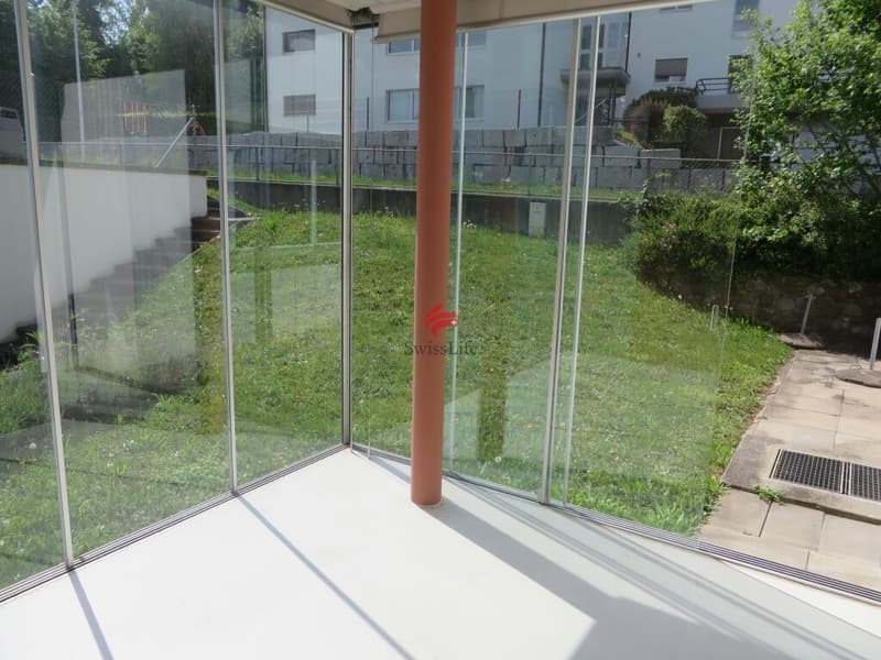 Wintergarten mit kleinem Gartenanteil