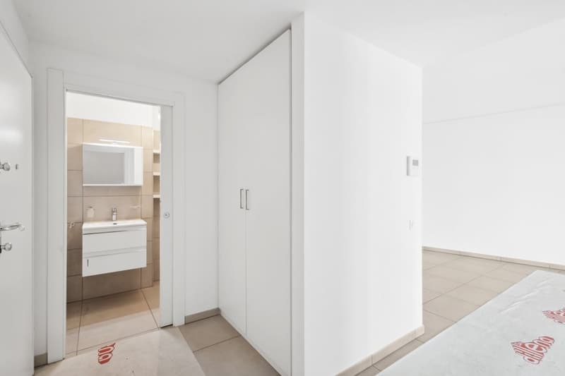 modern bathroom with sink, mirror, and shelves
