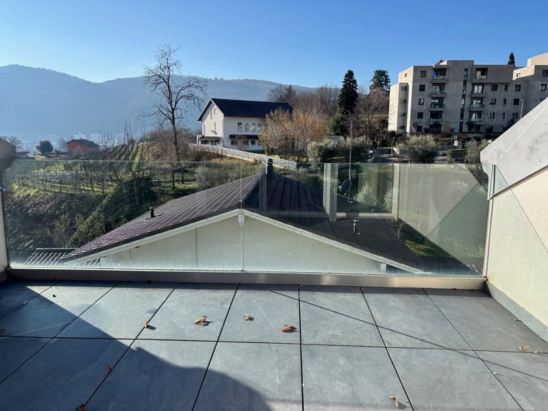 glass railings, tiled floor, view of surrounding area