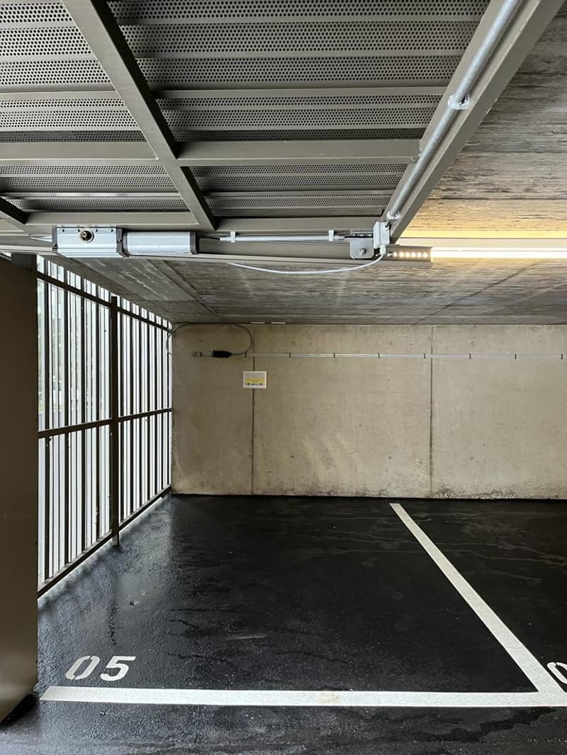 parking garage, concrete wall, metal gate, floor number 05