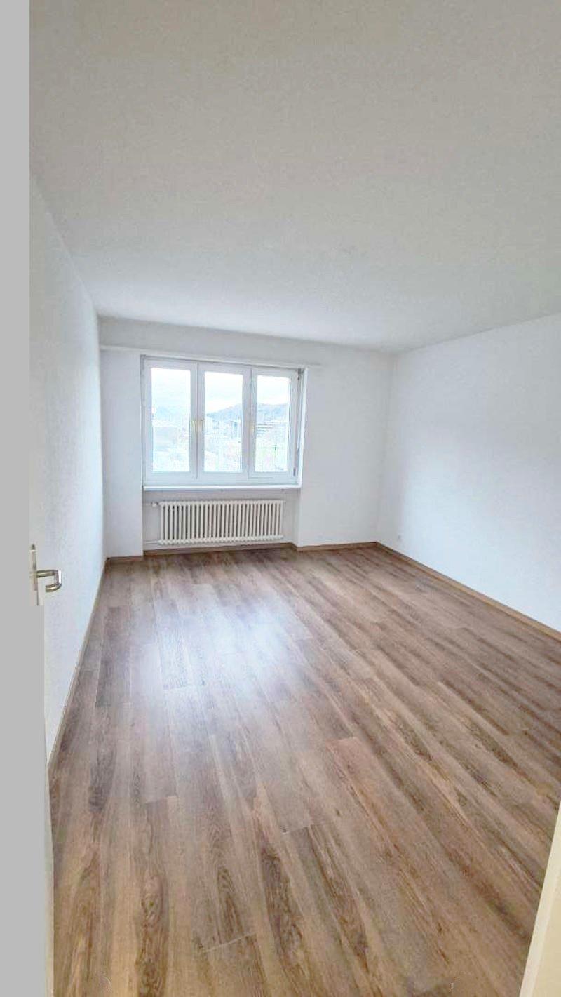 empty room, hardwood floor, white walls, window with outside view