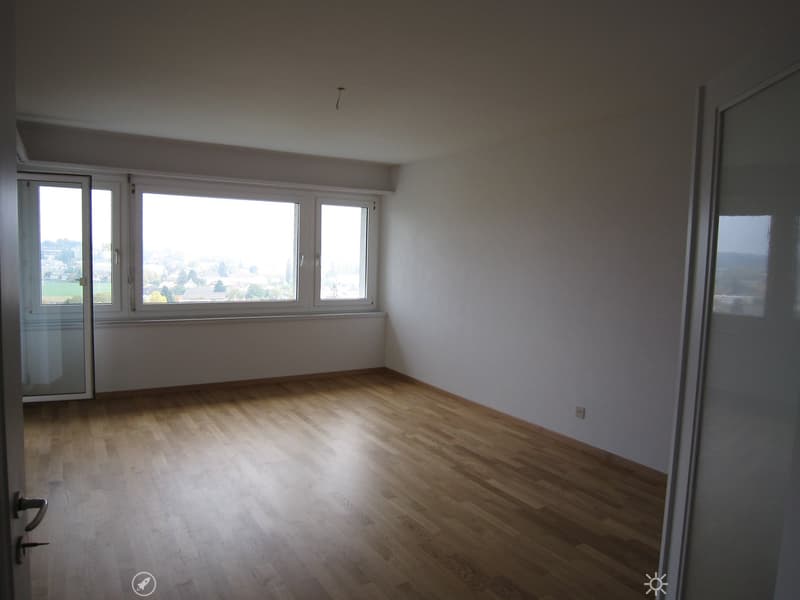 empty room, wooden floor, large windows, white walls, power outlet