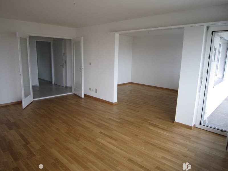 empty room, wooden floor, white walls, open doors, balcony