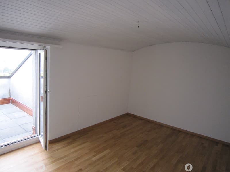 empty room, wooden floor, white walls, open door to balcony