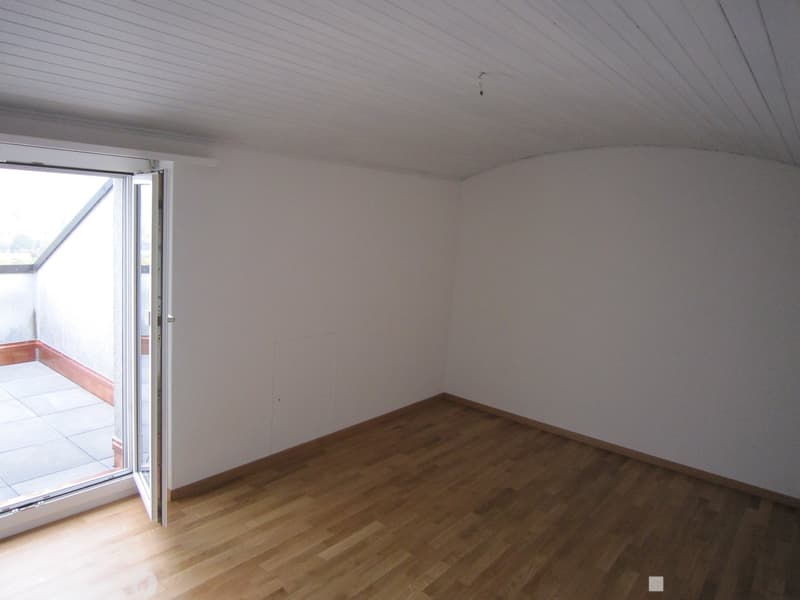 empty room, wooden floor, white walls, open door to balcony