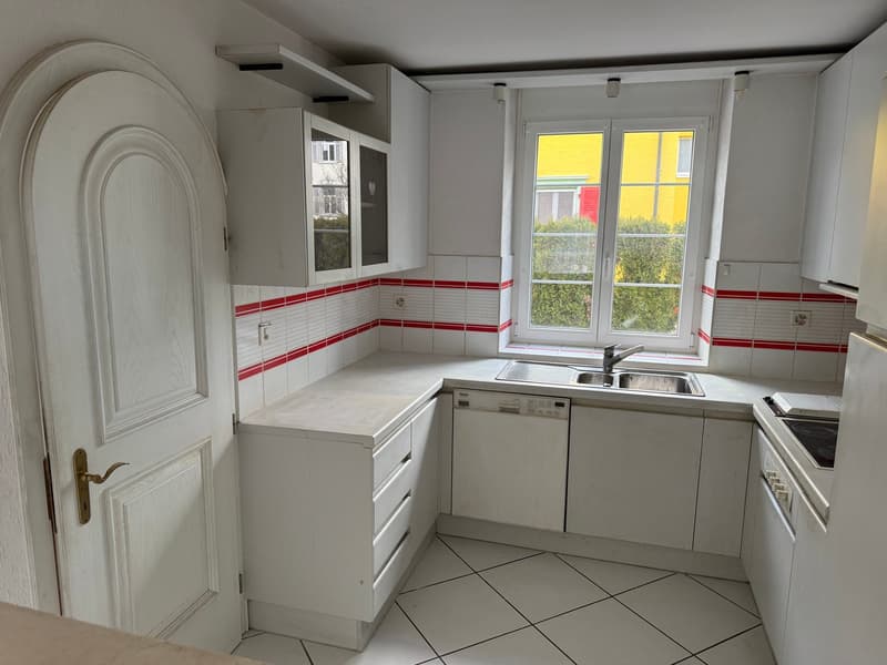 modern kitchen with white cabinets, tiled floor, stainless steel sink, dishwasher, electric stove