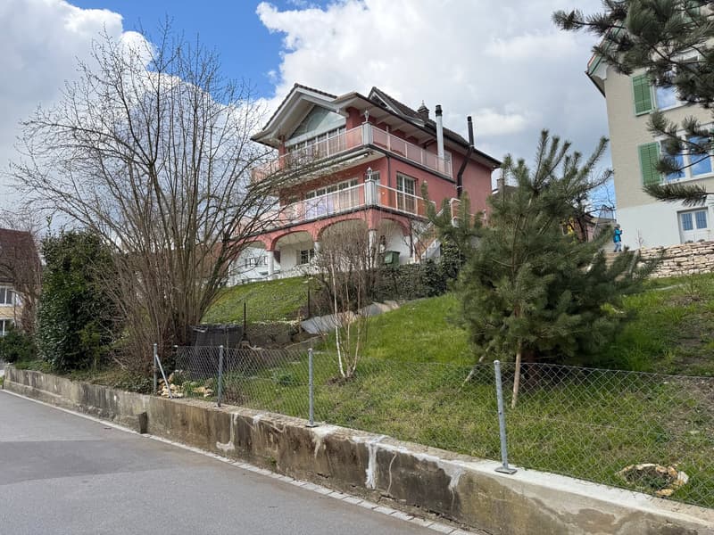 2 story house, red brick, white windows, balcony, garden, fence