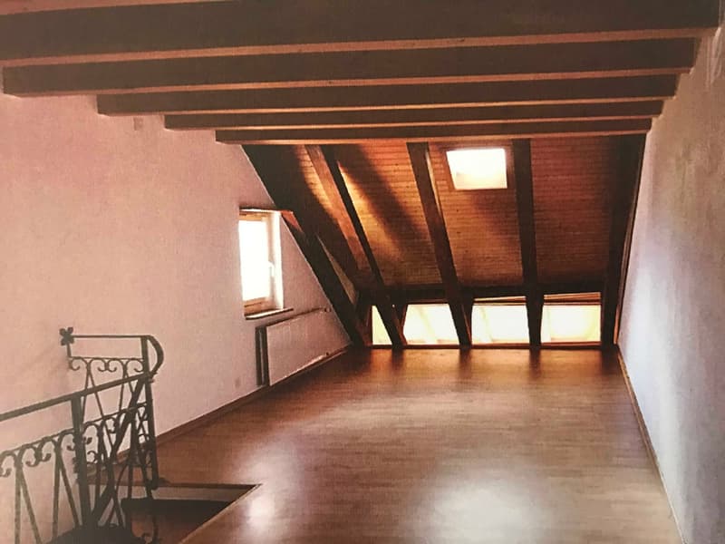 wooden beams, wooden floor, white walls, windows