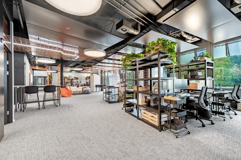 Open floor plan with modern furniture and large windows