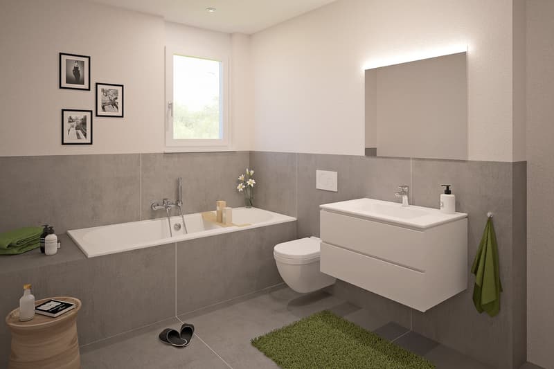 Modern bathroom with white vanity, bathtub, toilet, and gray tile walls. Decorative artwork on the walls and a green bath mat on the floor.