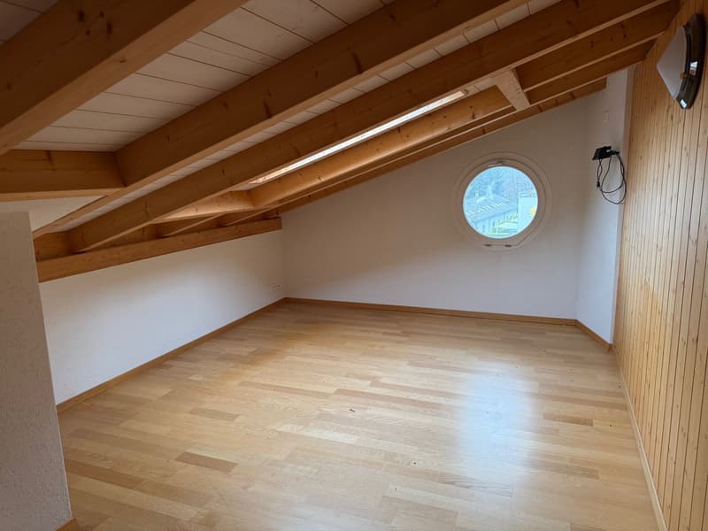 Empty room, wooden floor, wooden wall, wooden ceiling, round window, light fixtures