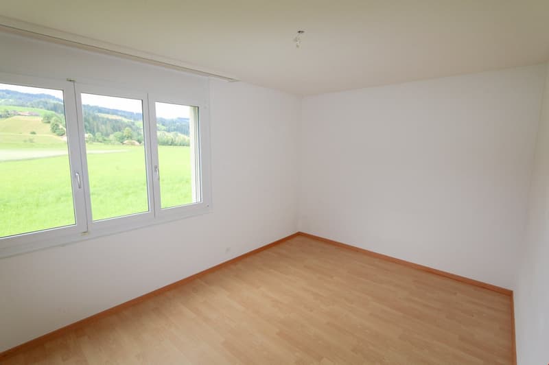 empty room, large window with view of the countryside