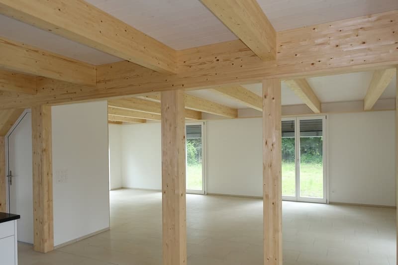 wooden beams, tile floor, white walls, two sliding doors leading to outside, wooden pillar