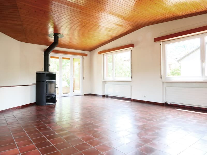 empty room, red tile floor, wooden ceiling, fireplace, glass doors, windows