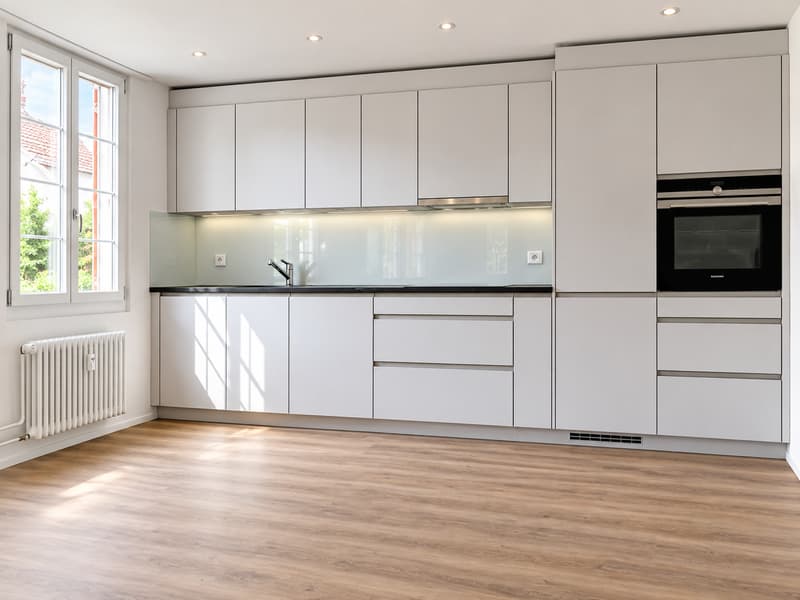 Wohnzimmer mit offener Küche