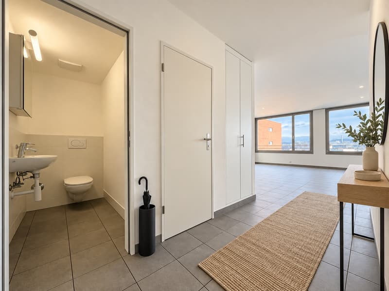 Eingang mit separatem WC (Die abgebildeten Möbel wurden mithilfe von KI ergänzt und dienen ausschliesslich der Veranschaulichung der Räume; die Wohnung wird unmöbliert vermietet)