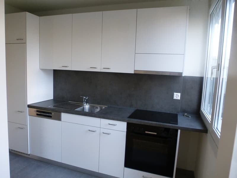 fully equipped kitchen, white cabinets, modern faucet, electric oven, sink with faucet, gray countertops, gray tiles