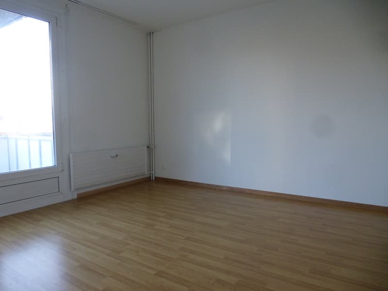 wooden floor, white walls, large window, balcony