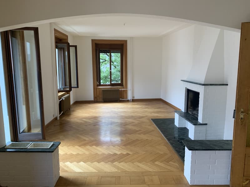 Living Room w/ balcony & Fireplace