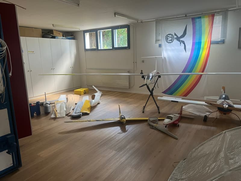 Wooden floor, aircrafts, boxes, cabinets, windows