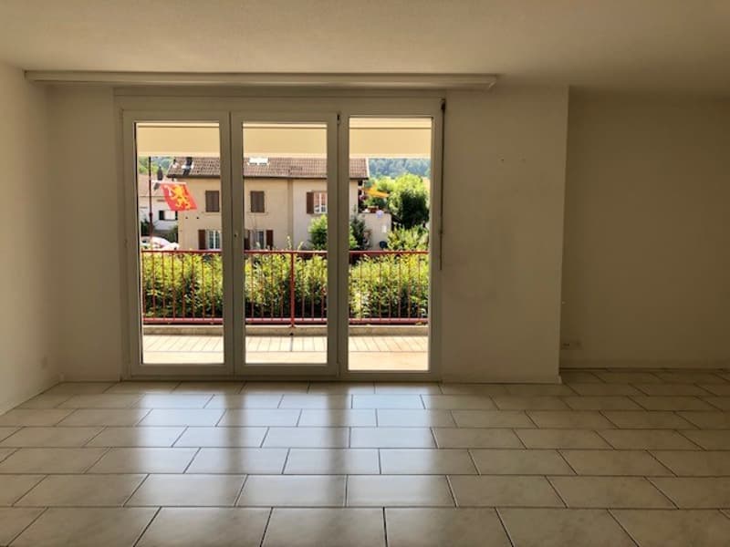 open room, glass sliding doors, balcony, tiled floor
