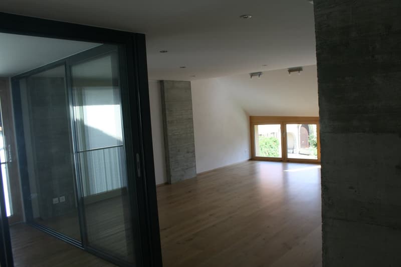 empty room, hardwood floor, sliding glass doors, balcony, large windows