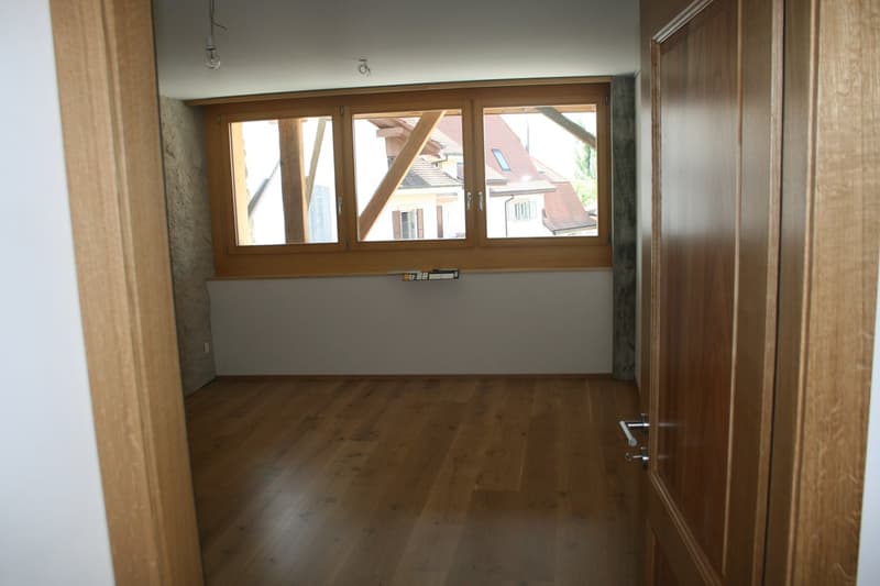 empty room, wooden floor, large window, white walls